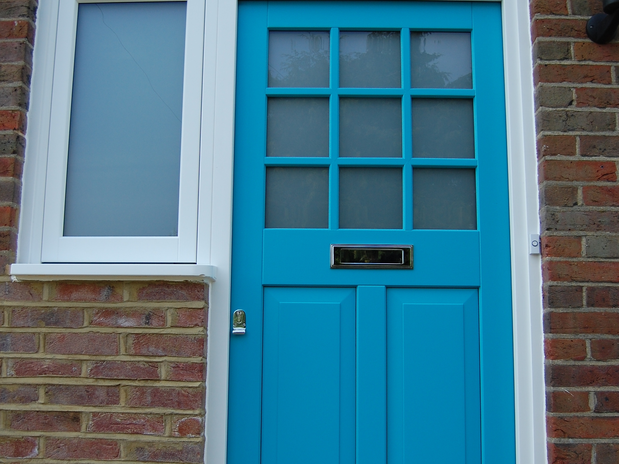 new turquoise front door 50s house